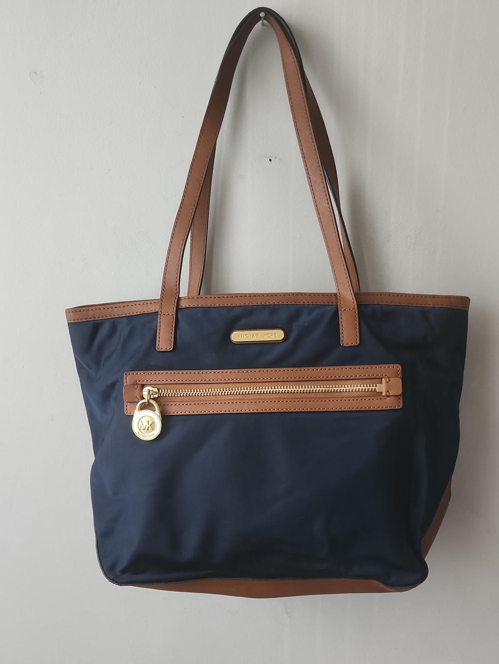 Michael Kors Navy Tote with Brown Trim and Gold Hardware. Great Condition